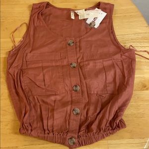 Orange tank with buttons